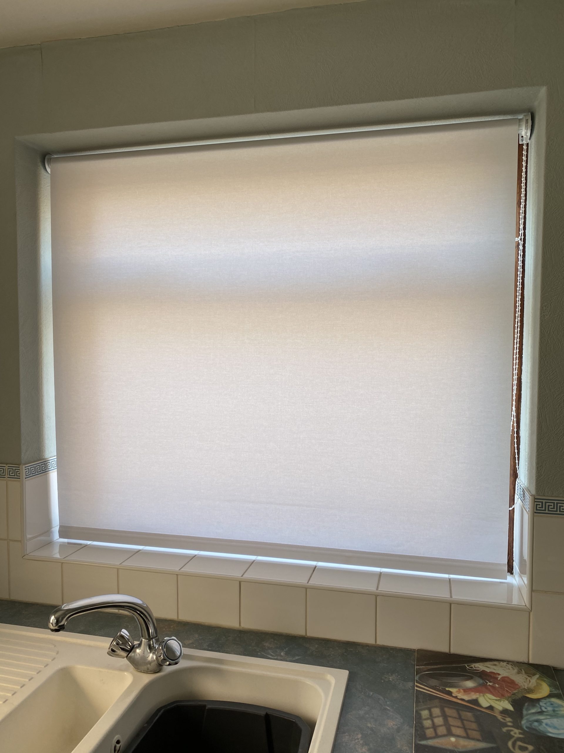 Sheer roller blinds for daytime privacy in a living area