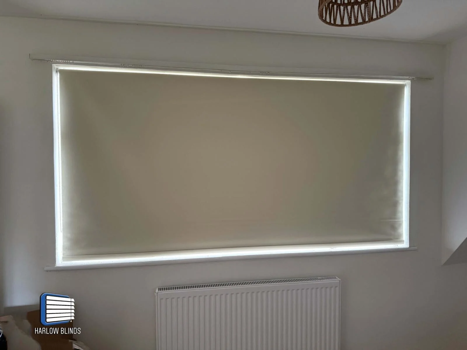 Blackout roller blind in beige supplied and fitted in Sheering