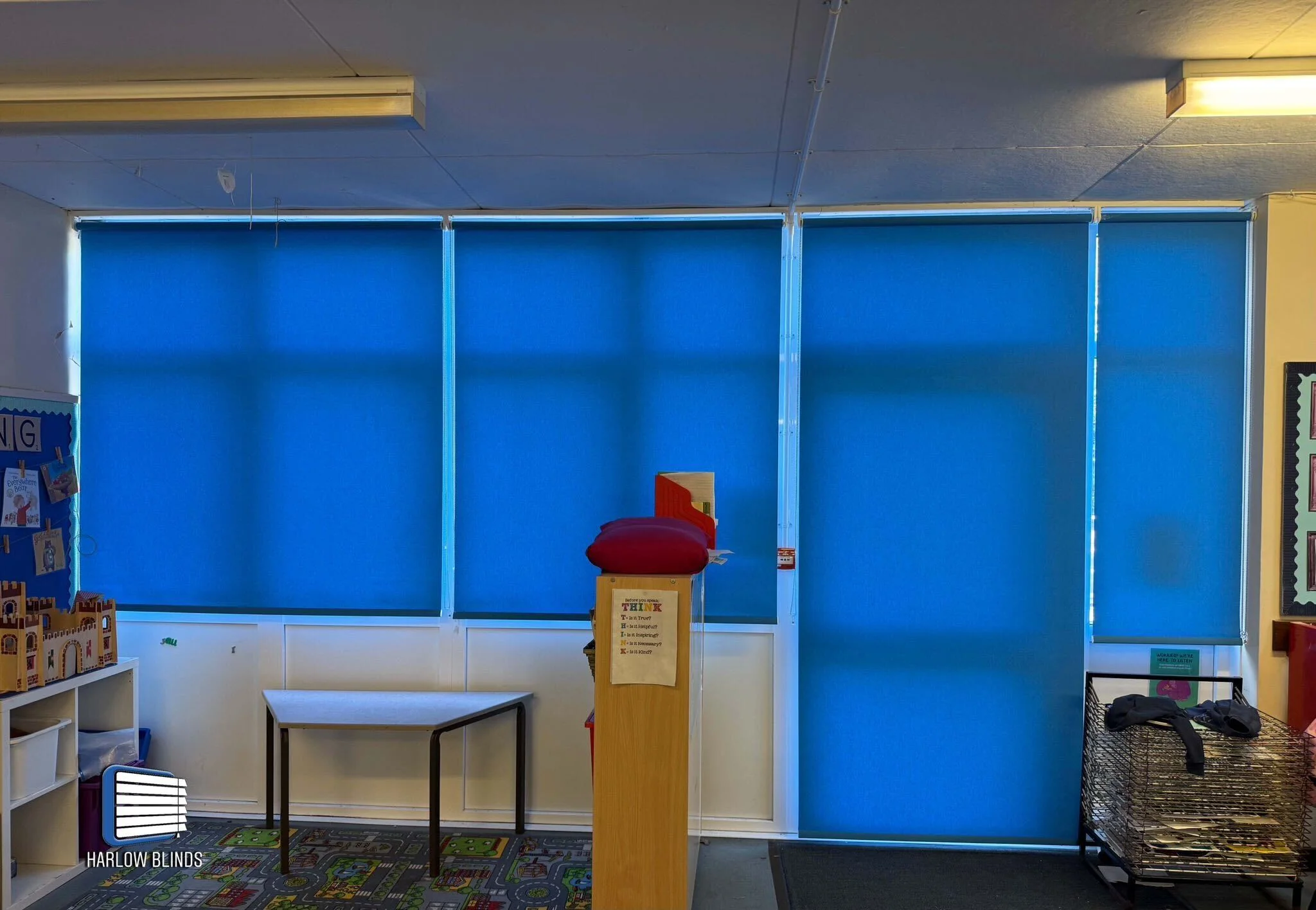 Roller blinds in Cyan flame retardant fabric, supplied and fitted in a school in Bishop's Stortford