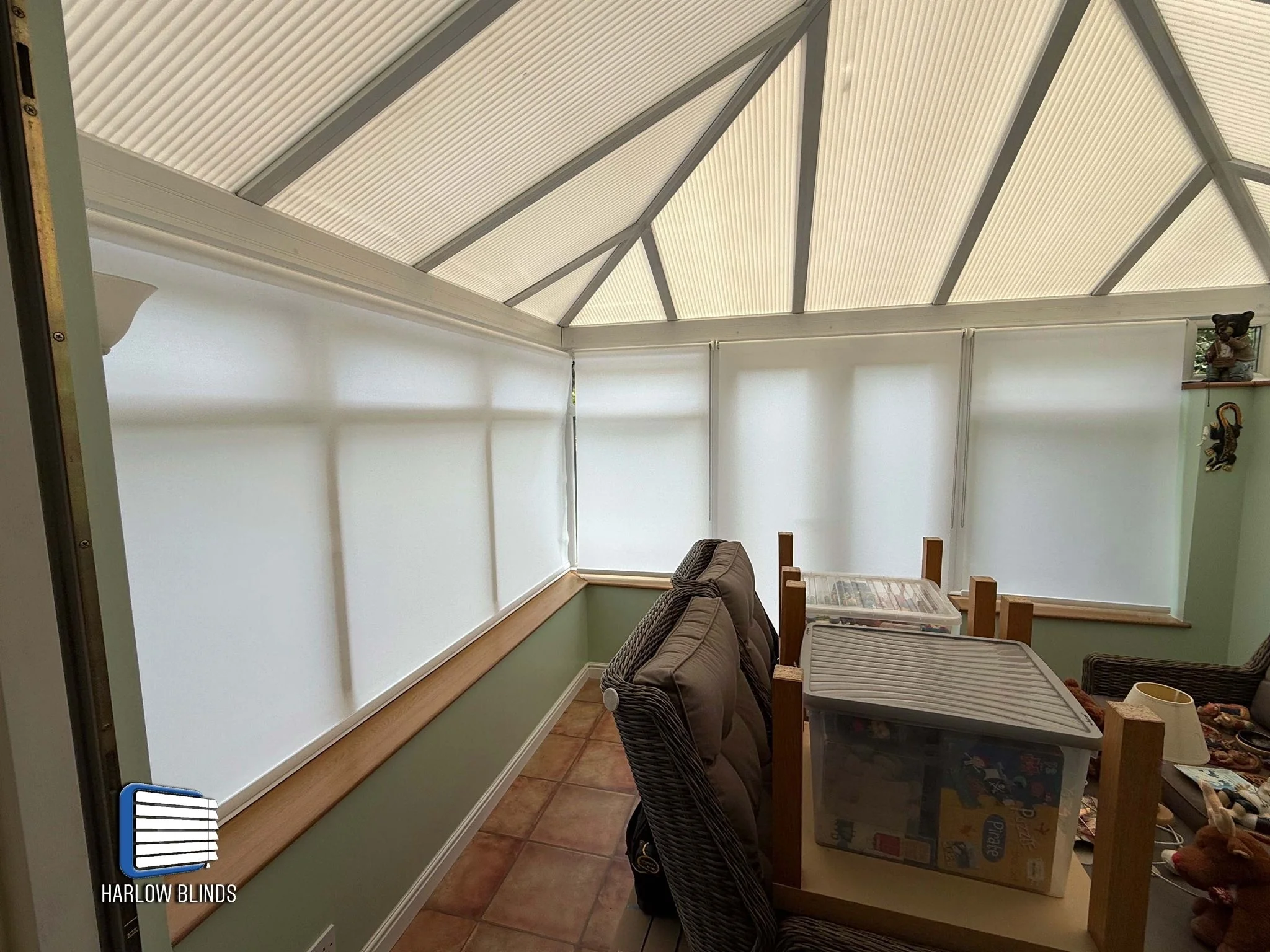 Roller blinds in white dim-out fabric supplied and fitted in Harlow